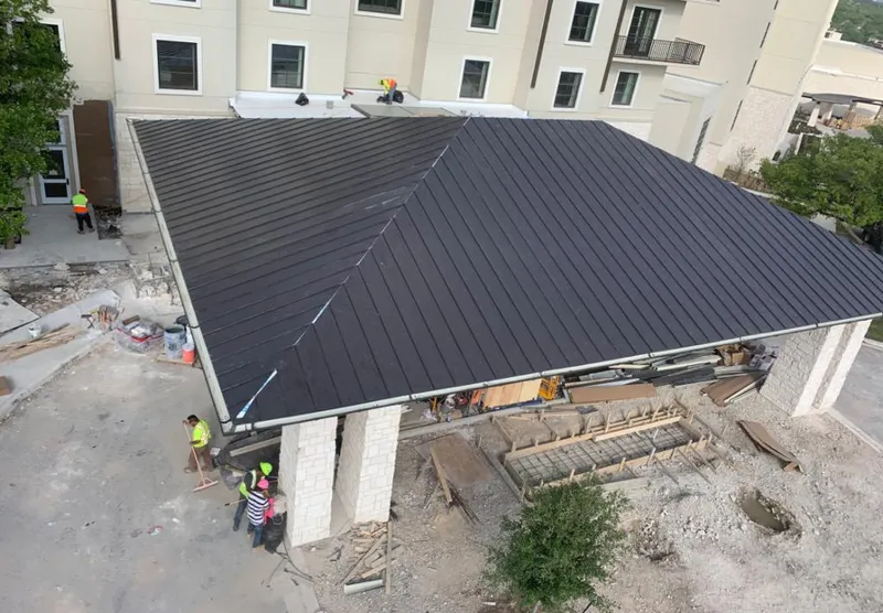 Metal roofing installation team working on a commercial building in Five Forks