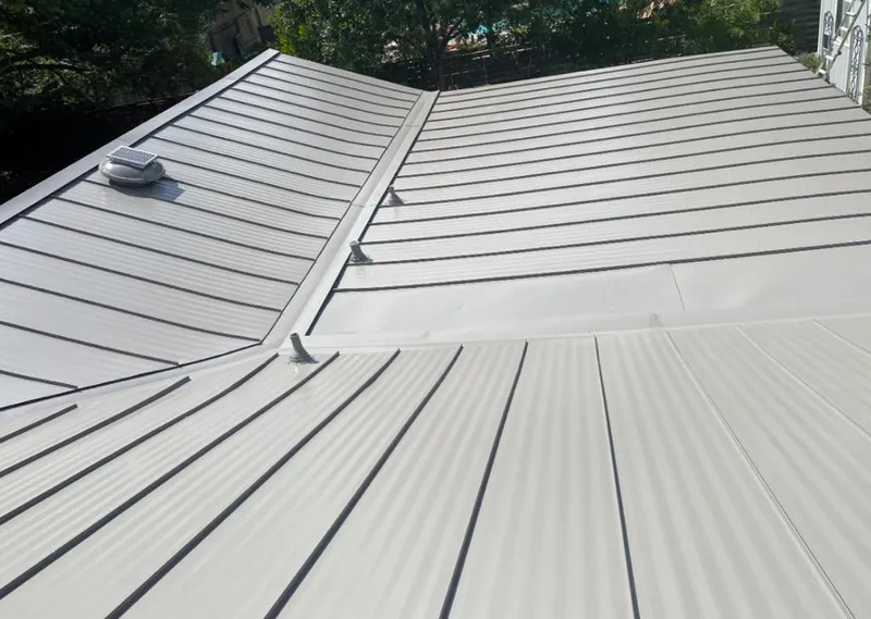 Solar attic fan installed on a metal roof for Roof Ventilation in Five Forks